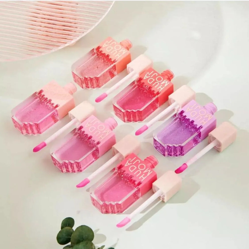 Hudamoji Transparent Lipgloss Oil in Light Pink Color Each Huda Moji
