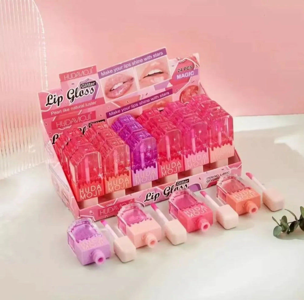 Hudamoji Transparent Lipgloss Oil in Light Pink Color Each Huda Moji