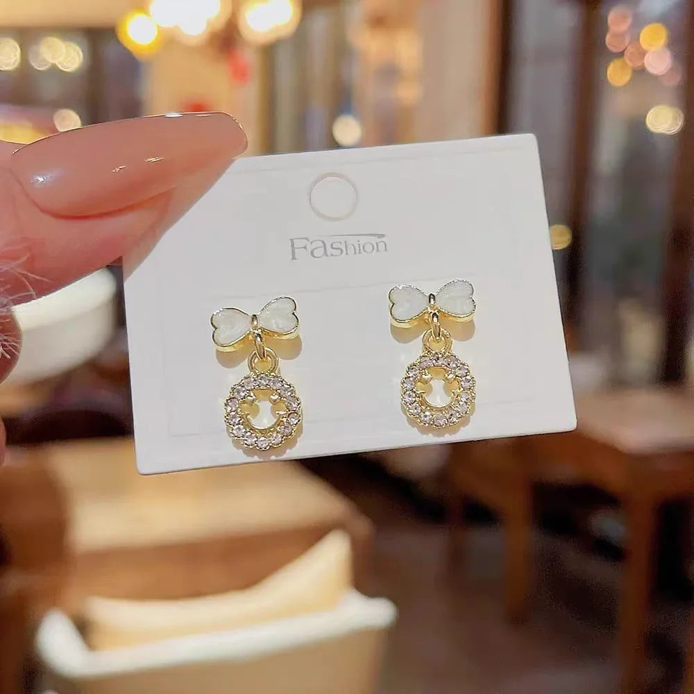Elegant Bow Hollow Circle Drop Earrings – Each Cosmia