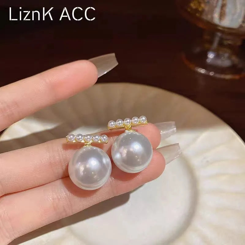 Pearl of Wisdom Gold Drop Earrings - Each Cosmia.pk