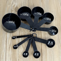 10-piece set of black plastic measuring cups and spoons. - Each Set Cosmia.pk